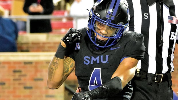 SMU running back Jaylan Knighton celebrates a touchdown in the third quarter of the Mustangs' 45-21 win over North Texas at Ford Stadium in Dallas.